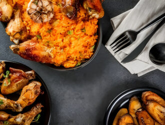 jollof-rice-in-black-plate-with-chicken-and-plantain-protein-rich-food